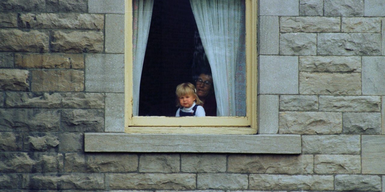 pexels-jean-papillon-6003158 man with a girl seeing outside from window