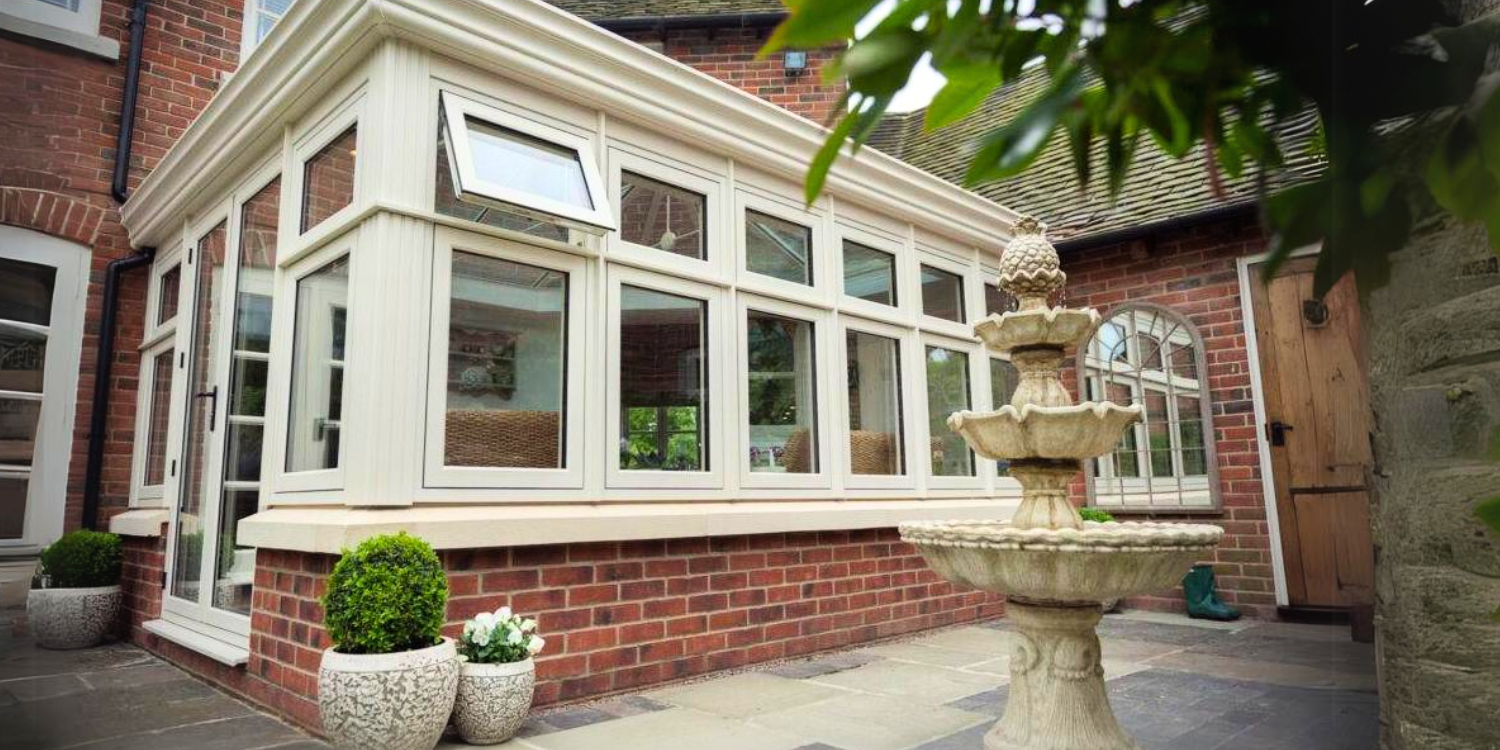 Conservatory and fountain in garden