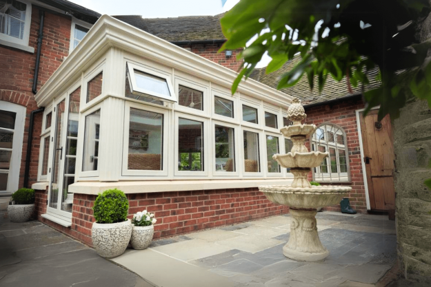Conservatory and fountain in garden